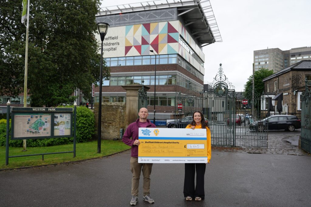 Cheque for £26,645 presented to Sheffield Children's Hospital Charity outside the hospital